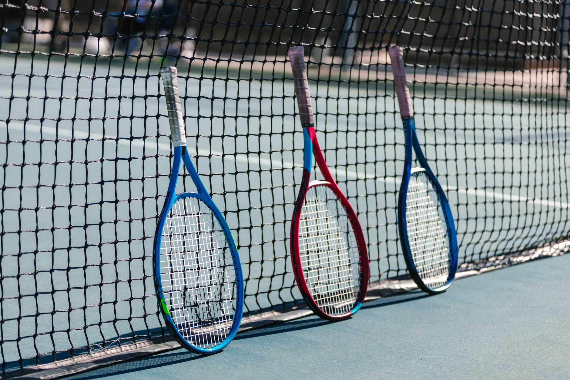 Tennis rackets on net