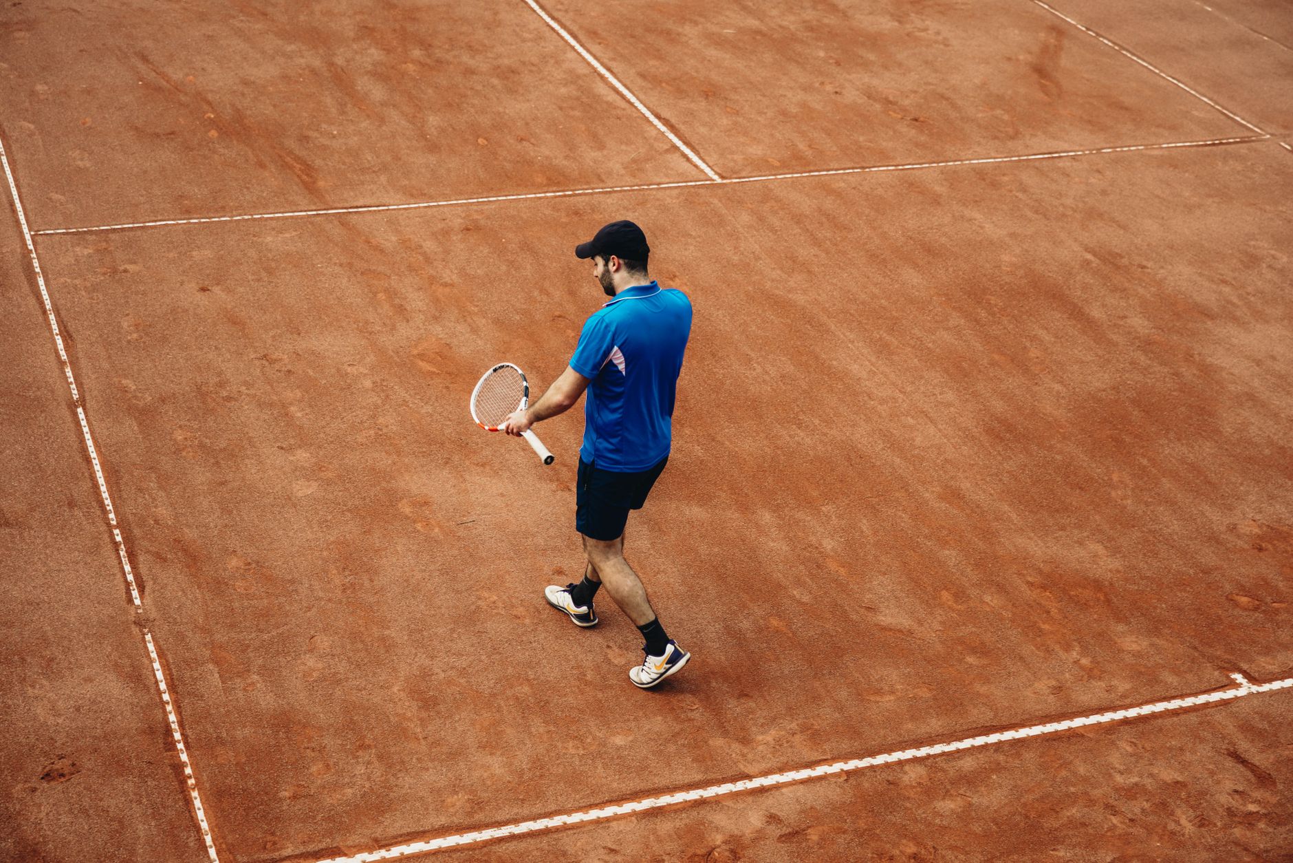 Man on tennis court