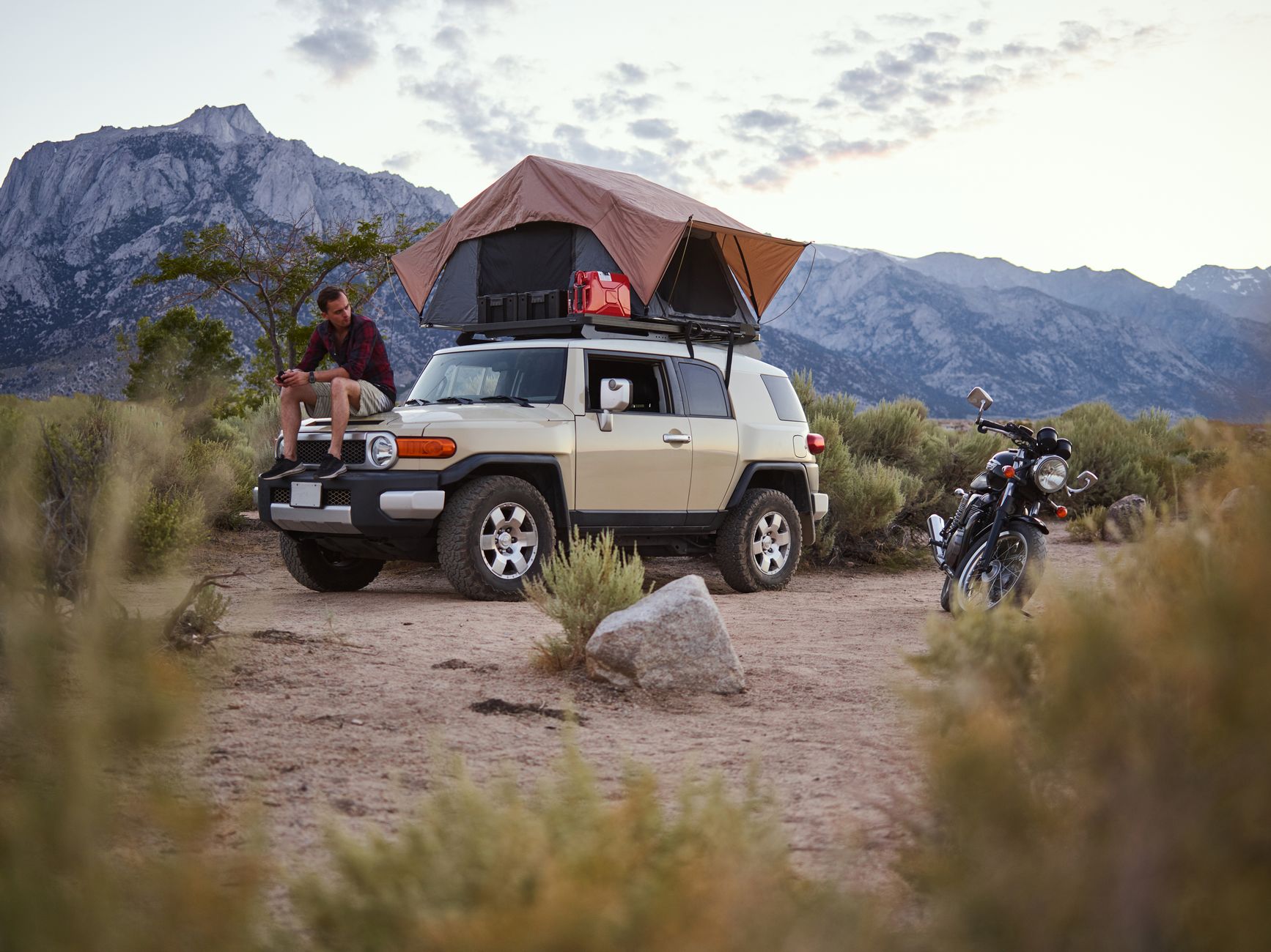 Man sitting on rooftop tent