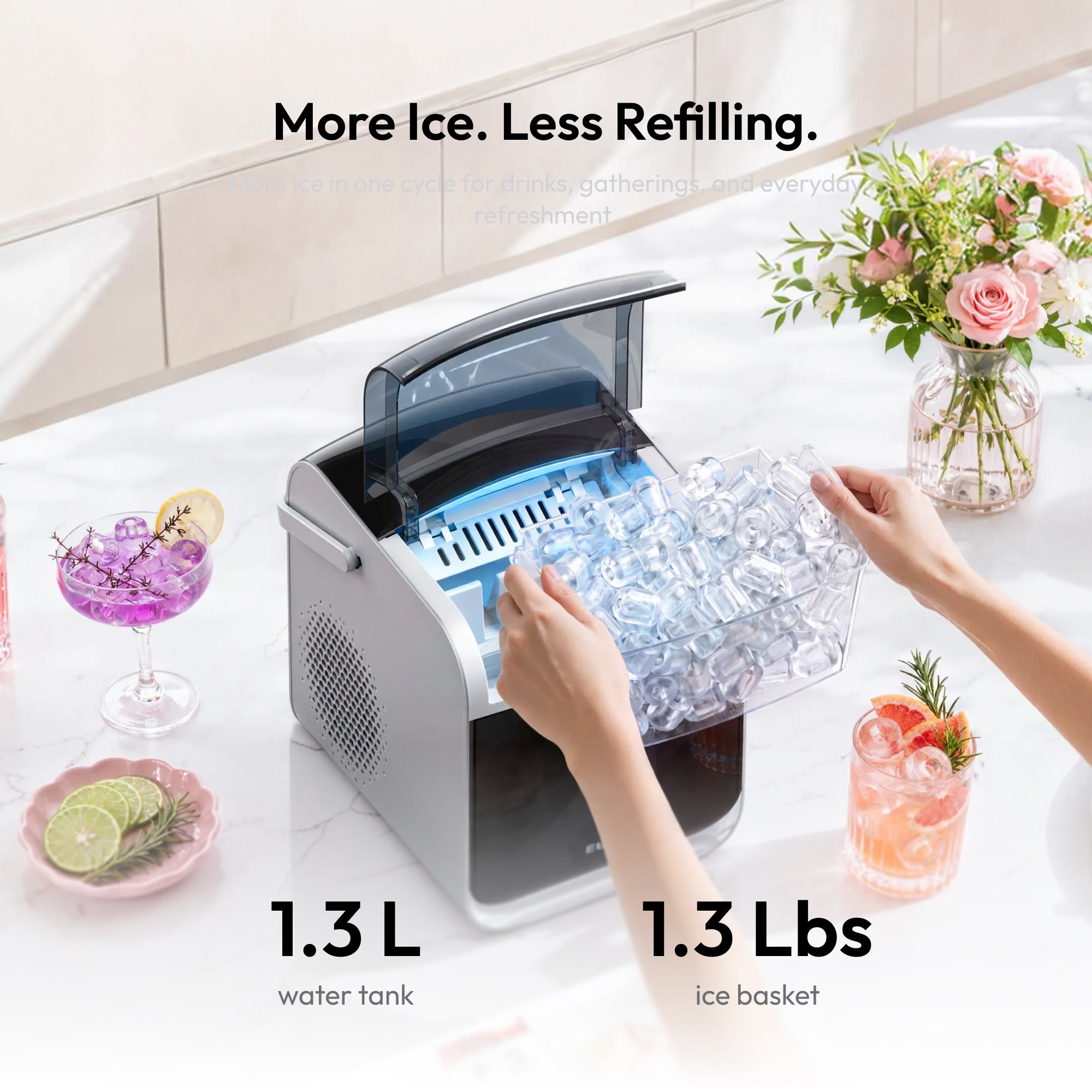 Hands retrieving ice from a portable ice maker with water tank and ice basket specifications displayed