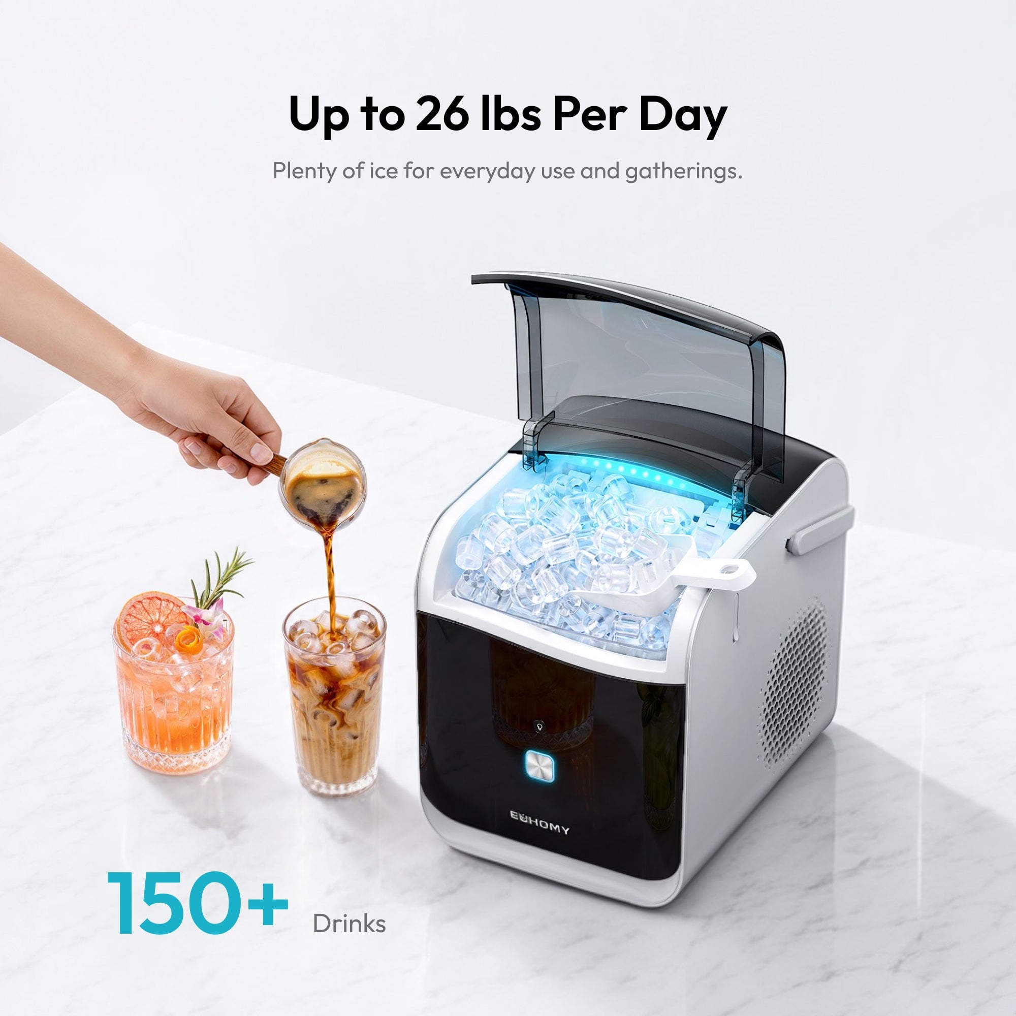 Hand scooping ice from an open portable ice maker with drinks and citrus nearby